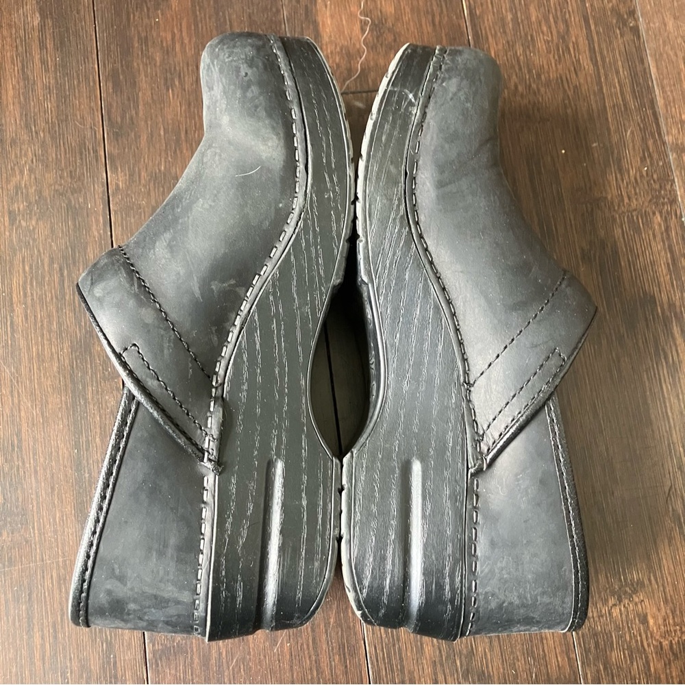 Dansko black leather slip on shoes.   Made for comfort! Excellent condition!
